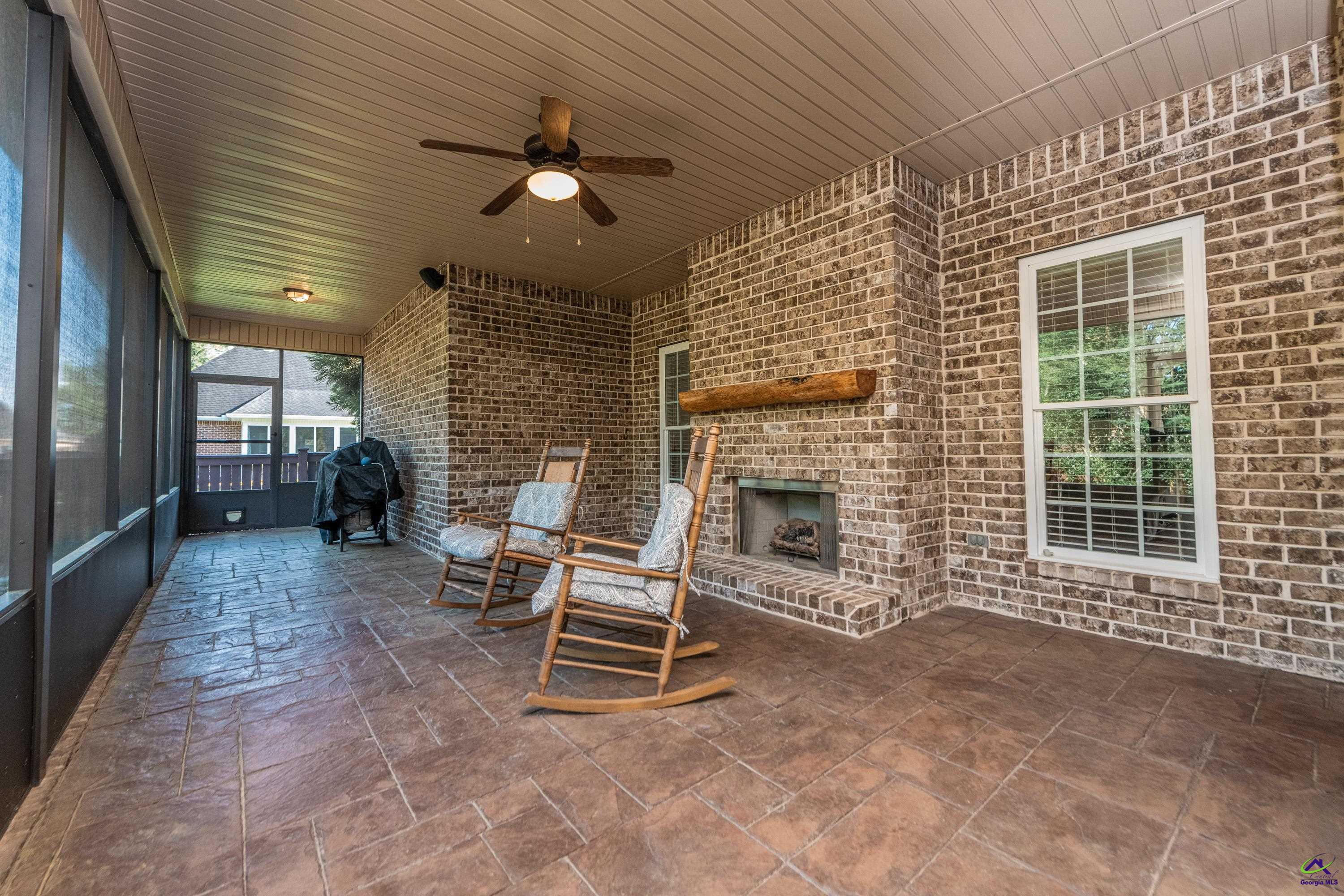 405 Old Bridge Road Warner Robins, GA 31088 - Photo 50 of 58 a view of a livingroom with a chair and a fireplace