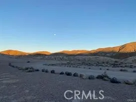 0 Joshua Edwards, CA 93523 - Photo 2 of 10 a view of a dry field with mountains in the background