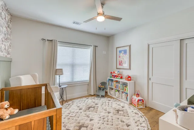 a bedroom with furniture and a window