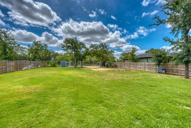 a backyard of a house with lots of green space