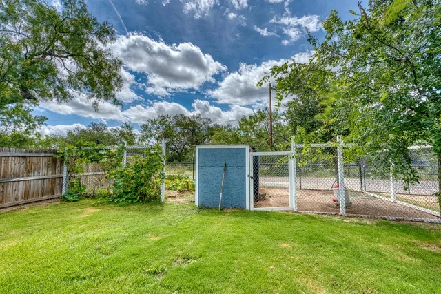 a view of backyard with green space