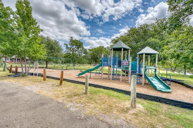 a view of a wooden deck with a yard