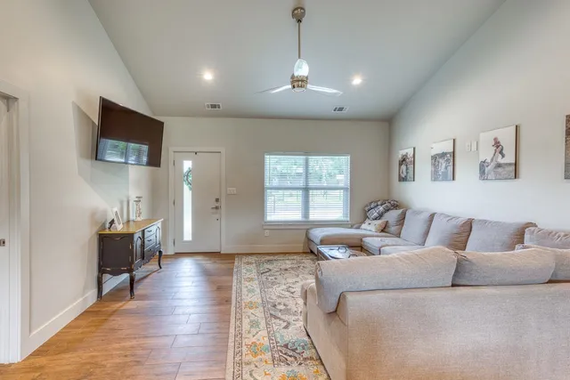 a living room with furniture and a window