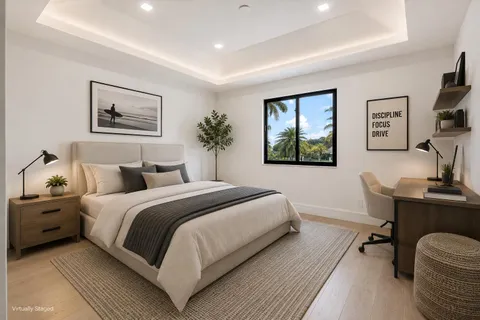 a bedroom with a bed and a desk