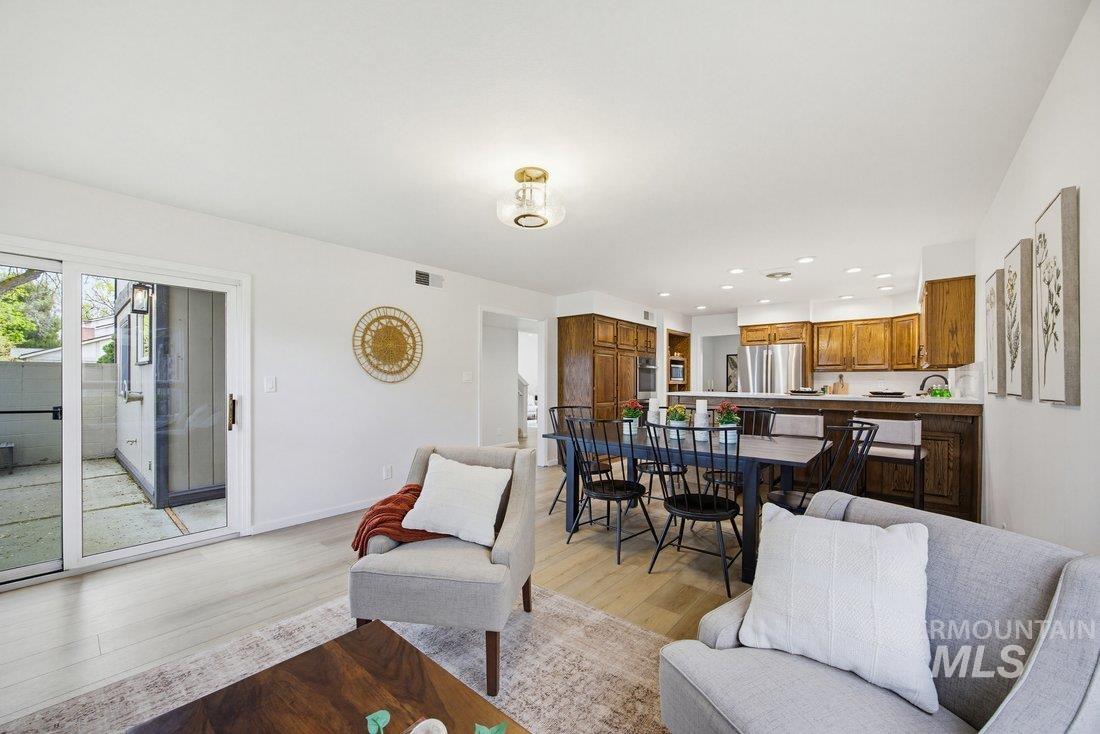 1549 Lenz Lane Boise, ID 83712 - Photo 29 of 42 Hearth area looking to outdoor patio, dining, and kitchen