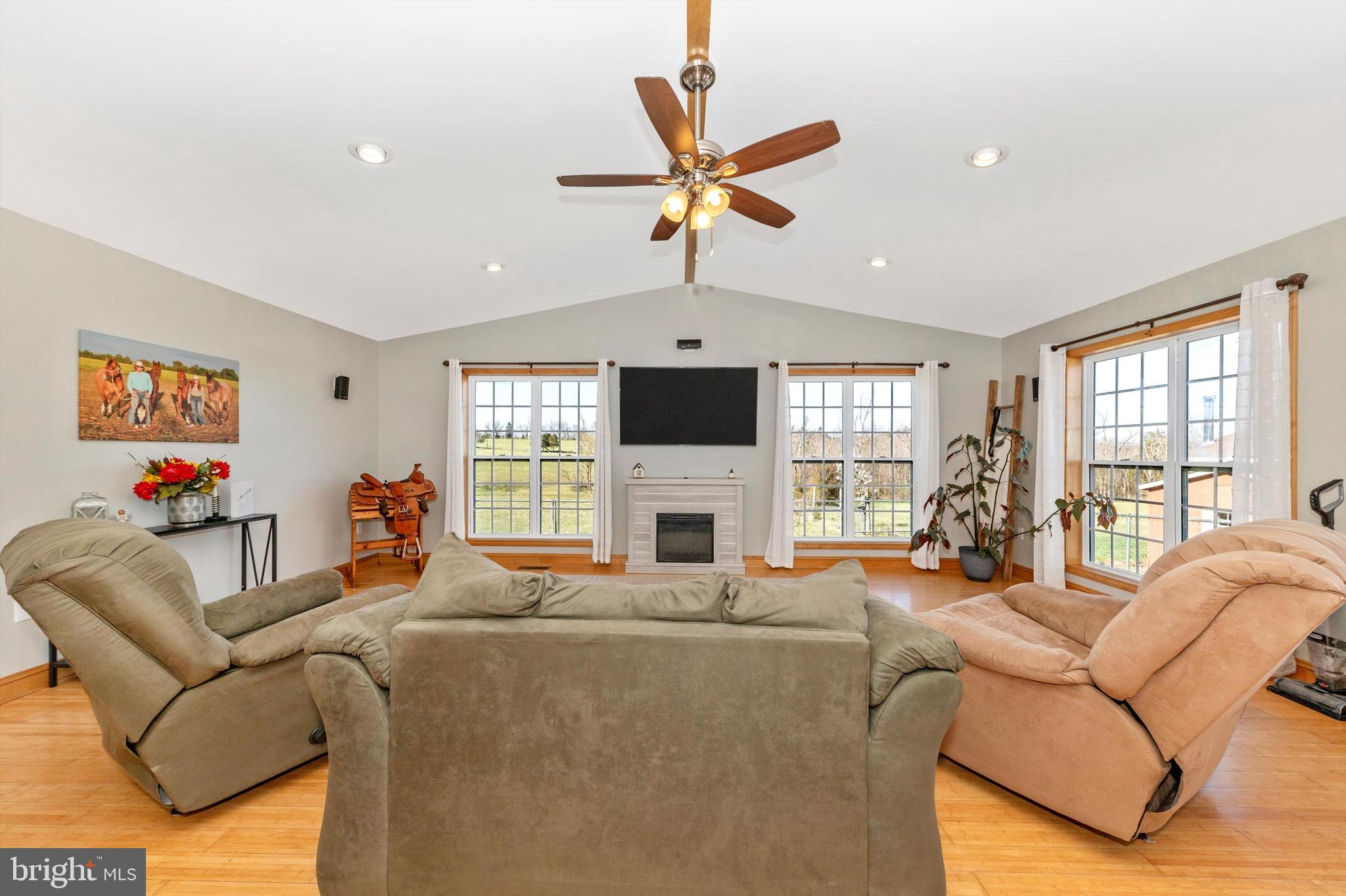 17449 Irishtown Road Emmitsburg, MD 21727 - Photo 12 of 77 a living room with furniture ceiling fan and a flat screen tv