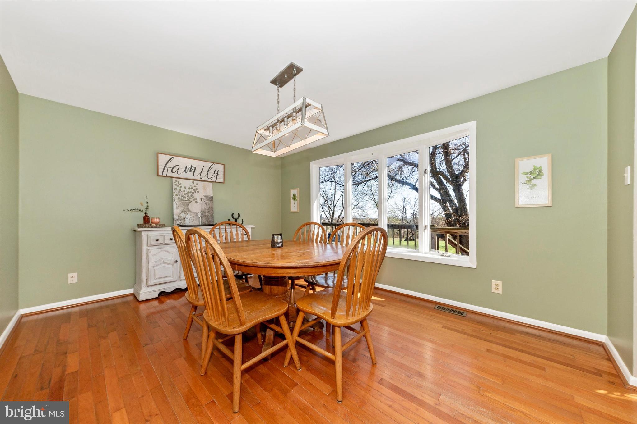 17449 Irishtown Road Emmitsburg, MD 21727 - Photo 3 of 77 a view of a dining room with furniture and wooden floor