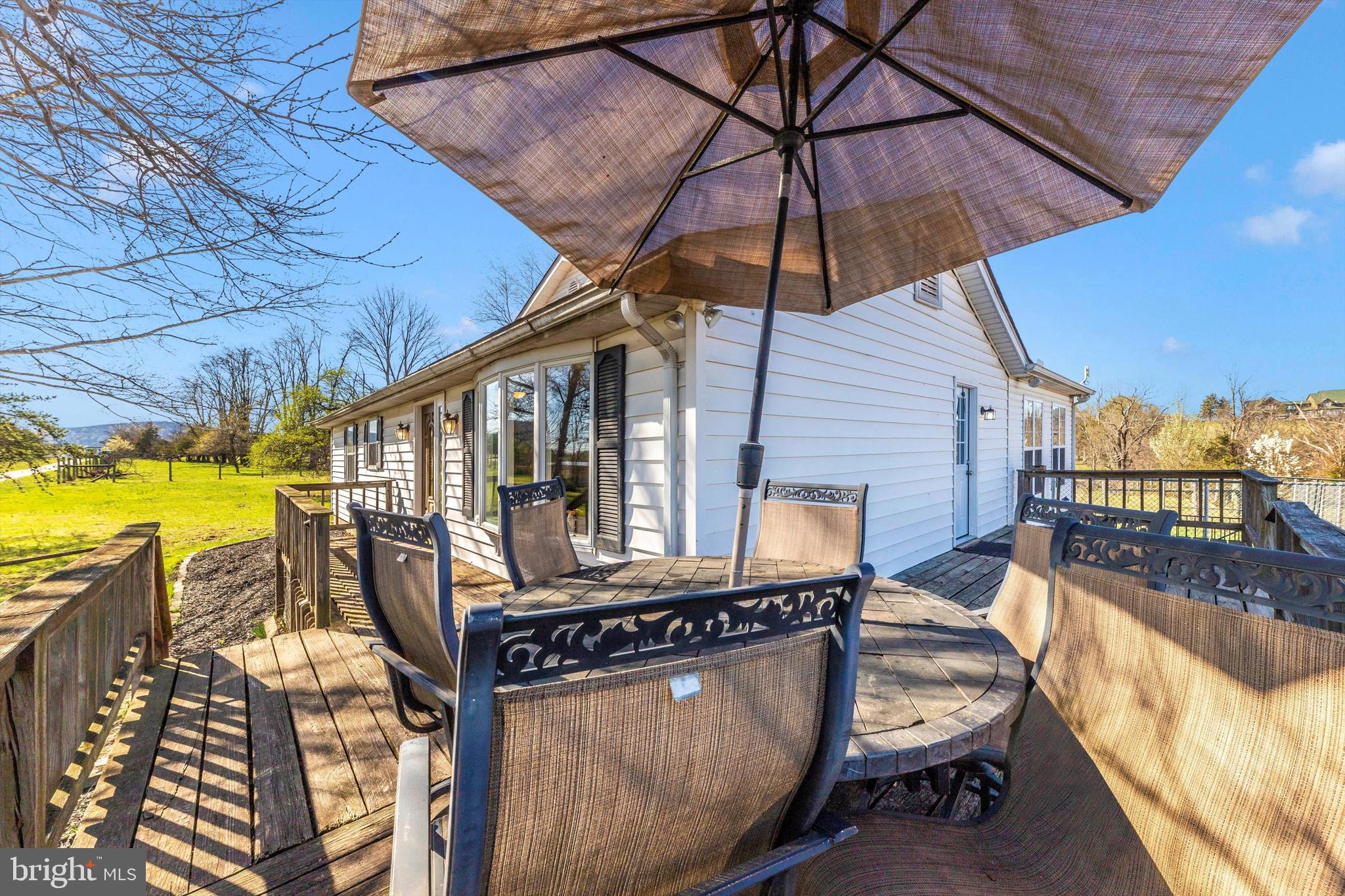 17449 Irishtown Road Emmitsburg, MD 21727 - Photo 42 of 77 a view of a balcony with two chairs and a umbrella