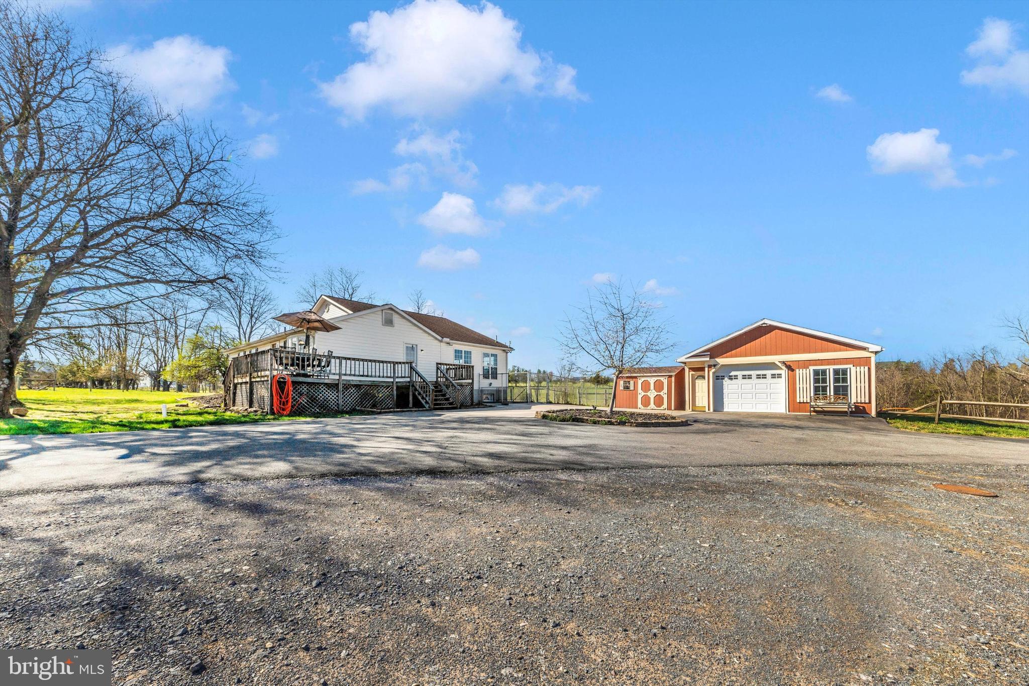 17449 Irishtown Road Emmitsburg, MD 21727 - Photo 48 of 77 a front view of a house with a yard and garage