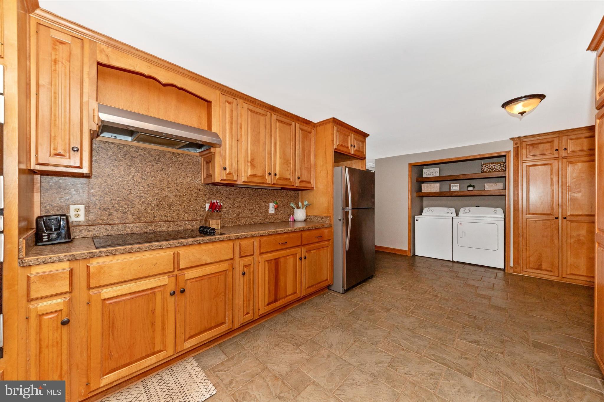 17449 Irishtown Road Emmitsburg, MD 21727 - Photo 6 of 77 a kitchen with granite countertop a refrigerator and cabinets