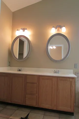 a bathroom with a tub sink and window