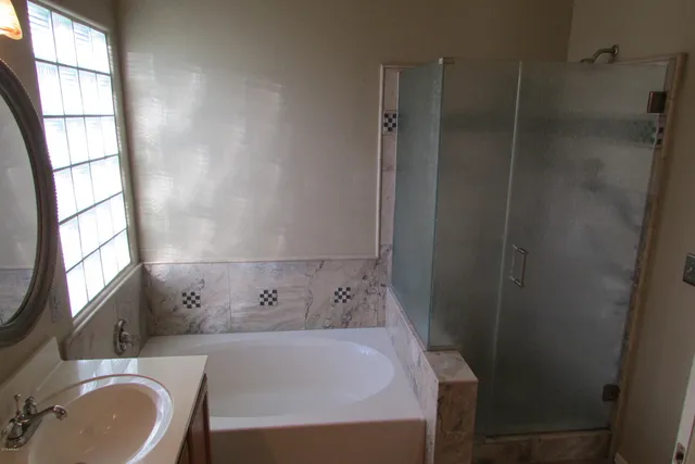 a view of a closet with wooden floor