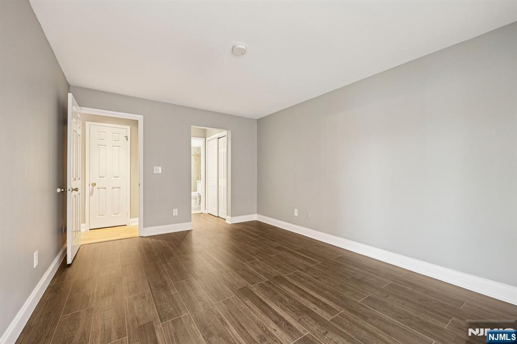 105 State Street, Unit 1H Hackensack, NJ 07601 - Photo 13 of 23 a view of an empty room and wooden floor