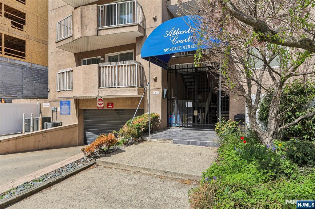 105 State Street, Unit 1H Hackensack, NJ 07601 - Photo 2 of 23 a view of a house with a yard