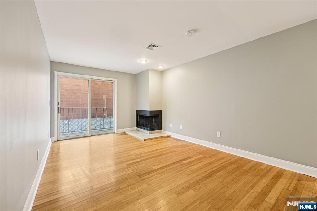 105 State Street, Unit 1H Hackensack, NJ 07601 - Photo 7 of 23 a view of an empty room with a window