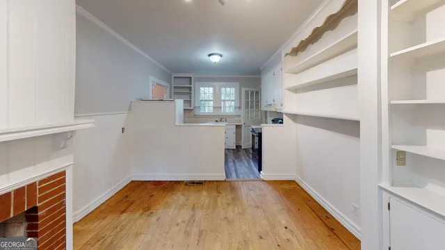a kitchen with a refrigerator and a sink