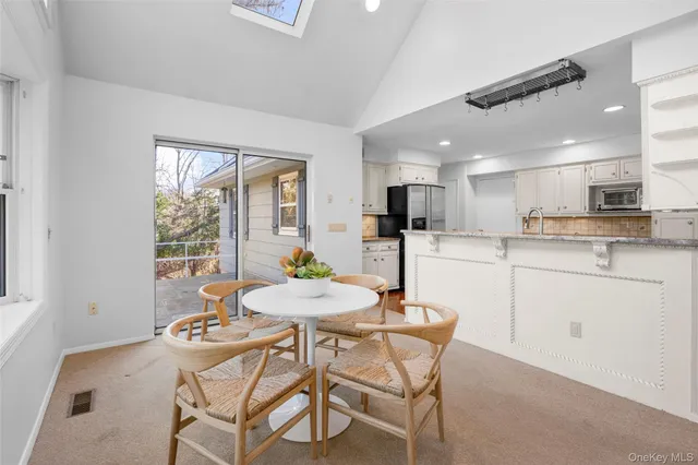 a kitchen with a table and chairs in it