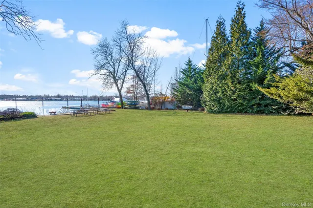 a view of yard with swimming pool and green space