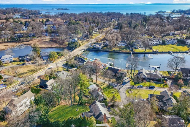 an aerial view of lake residential house with swimming pool and outdoor space