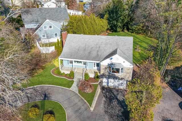 an aerial view of a house with a garden
