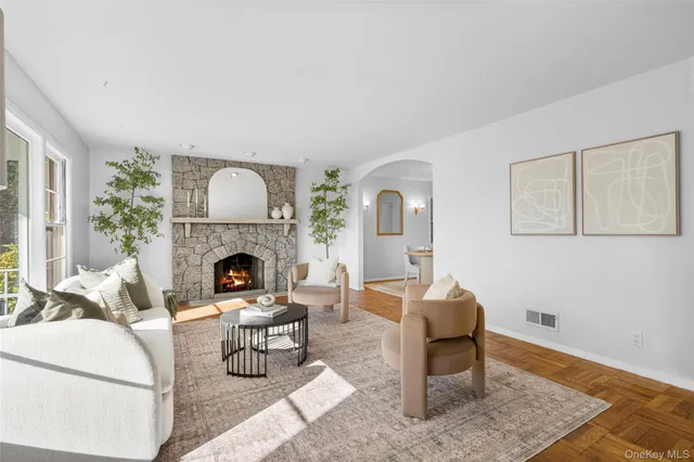a living room with furniture and a fireplace