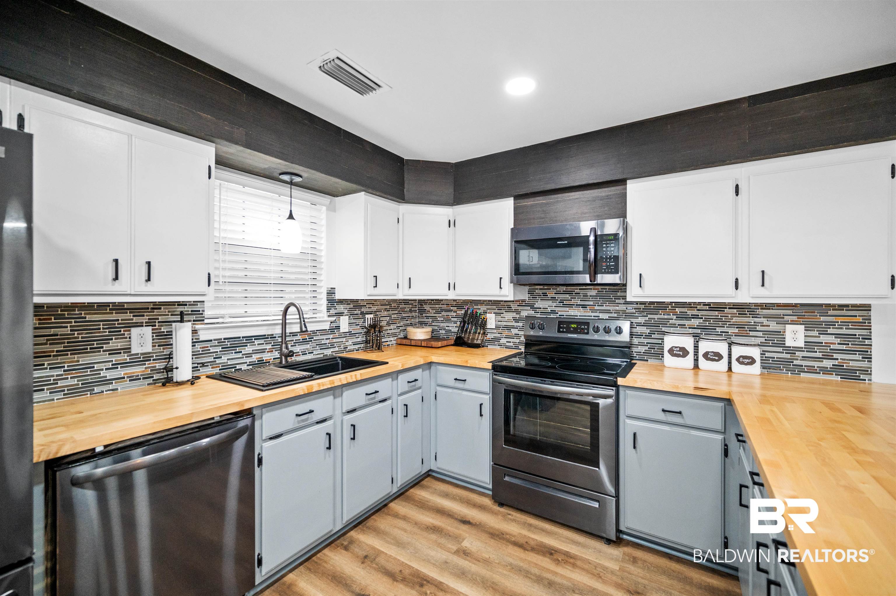 19274 Rada Road Silverhill, AL 36576 - Photo 5 of 18 Kitchen featuring gray cabinets, stainless steel appliances, butcher block counters