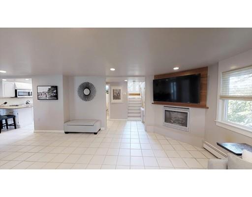 115 Fulton Spring Road Medford, MA 02155 - Photo 12 of 39 a living room with furniture and a flat screen tv