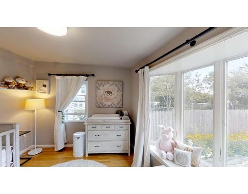 115 Fulton Spring Road Medford, MA 02155 - Photo 20 of 39 a living room with furniture and a large window