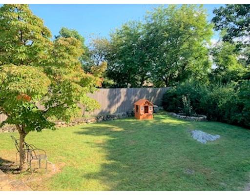 115 Fulton Spring Road Medford, MA 02155 - Photo 38 of 39 a backyard of a house with table and chairs