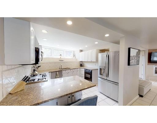 115 Fulton Spring Road Medford, MA 02155 - Photo 6 of 39 a kitchen with stainless steel appliances kitchen island granite countertop a refrigerator and a sink