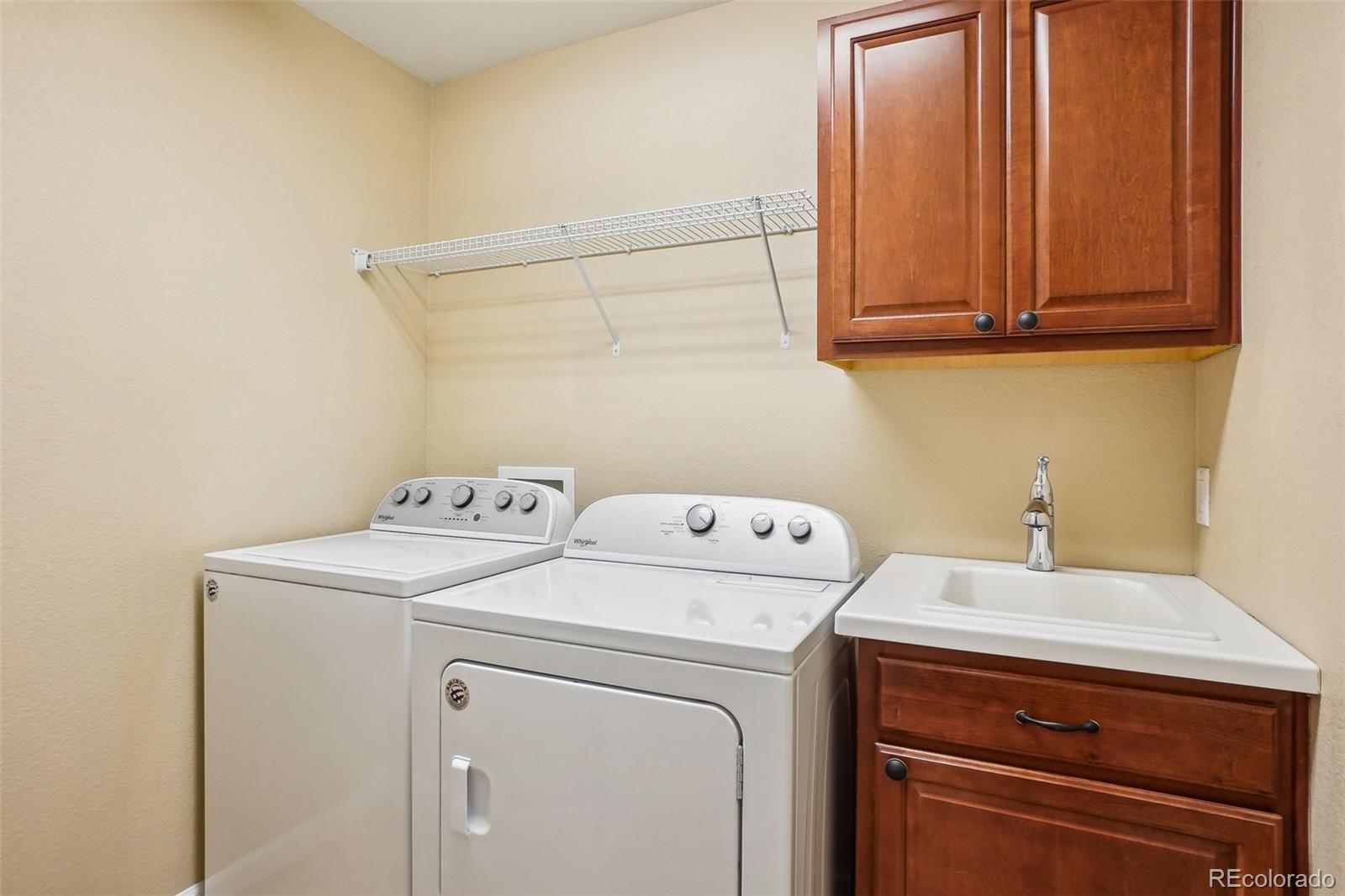 2605 Gray Wolf Loop Broomfield, CO 80023 - Photo 32 of 49 a utility room with dryer and washer