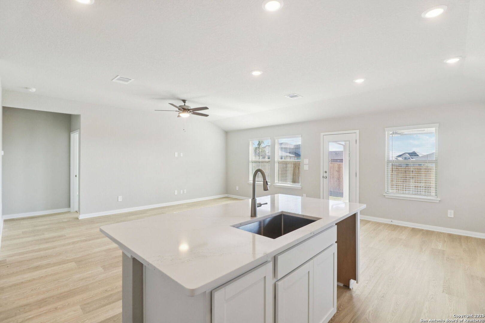 114 Dakota Ridge Cibolo, TX 78108 - Photo 13 of 39 a kitchen with a sink and chandelier
