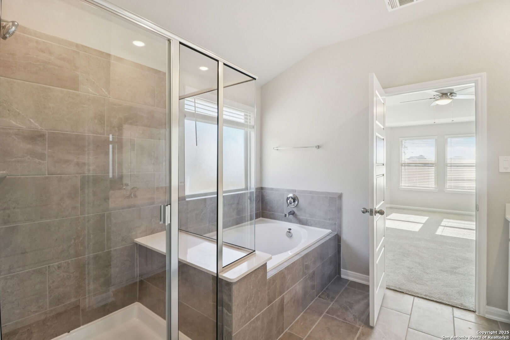 114 Dakota Ridge Cibolo, TX 78108 - Photo 30 of 39 a bathroom with a tub shower vanity and sink