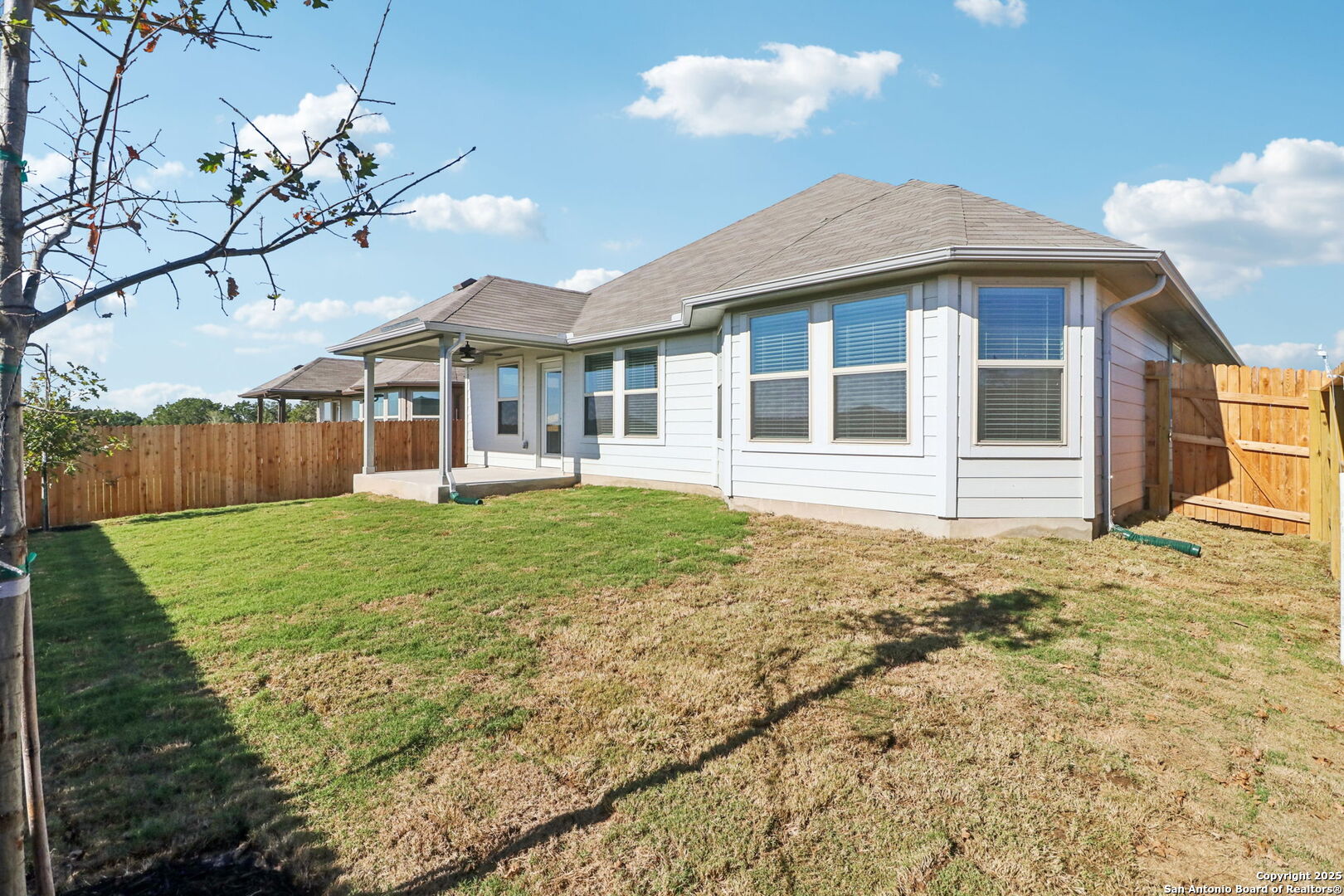 114 Dakota Ridge Cibolo, TX 78108 - Photo 32 of 39 a front view of a house with a yard and potted plants