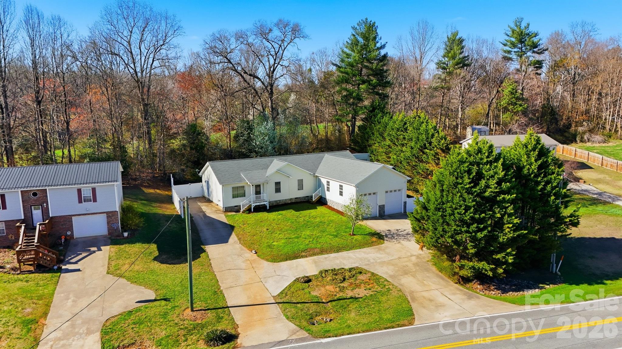 4771 Petra Mill Road Granite Falls, NC 28630 - Photo 14 of 46 an aerial view of a house with swimming pool and garden