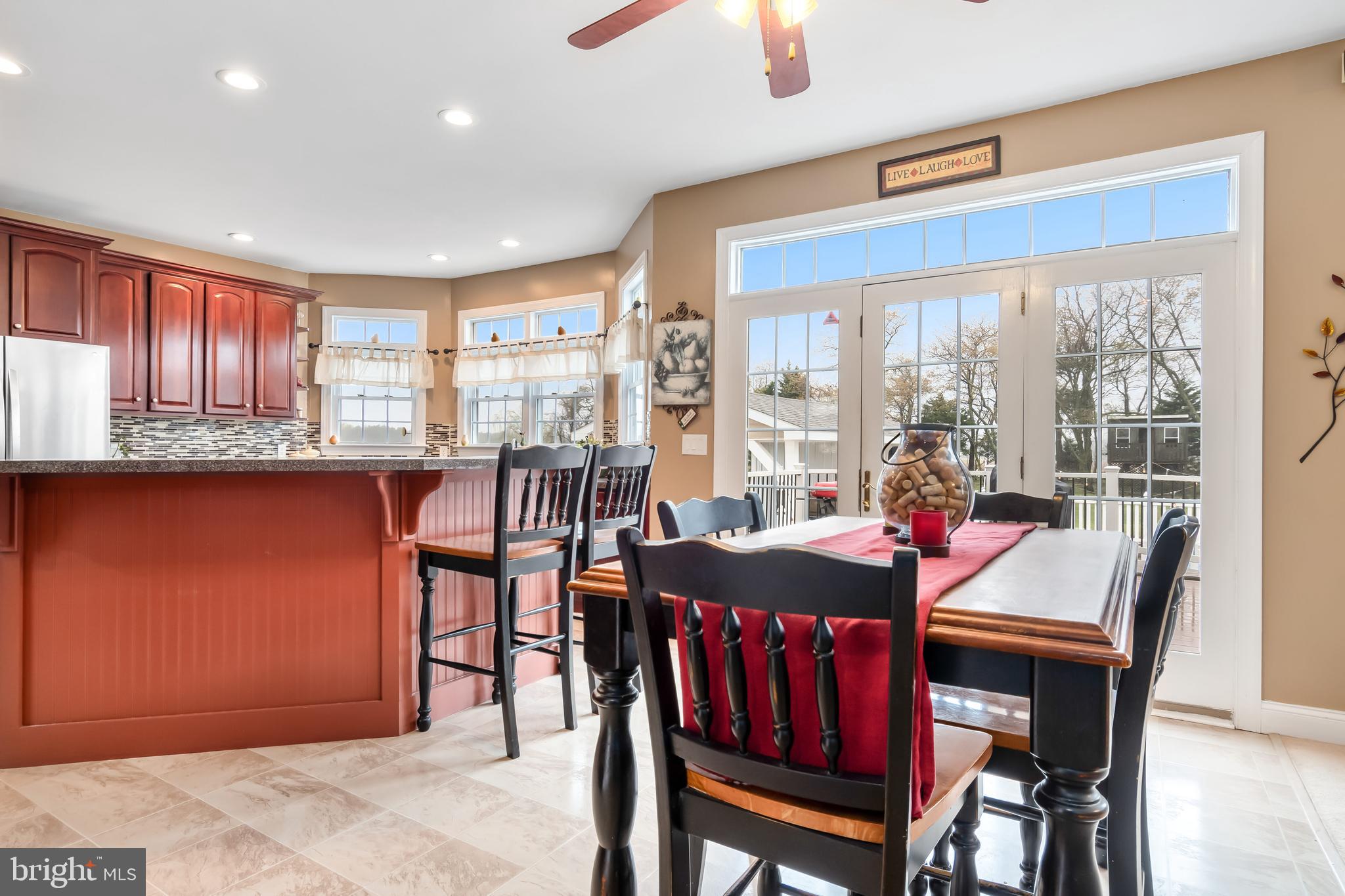 5855 Bethlehem Road Preston, MD 21655 - Photo 24 of 43 a dining room with furniture a rug and a large window
