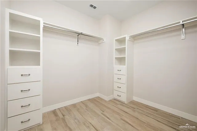 a view of an empty walk in closet