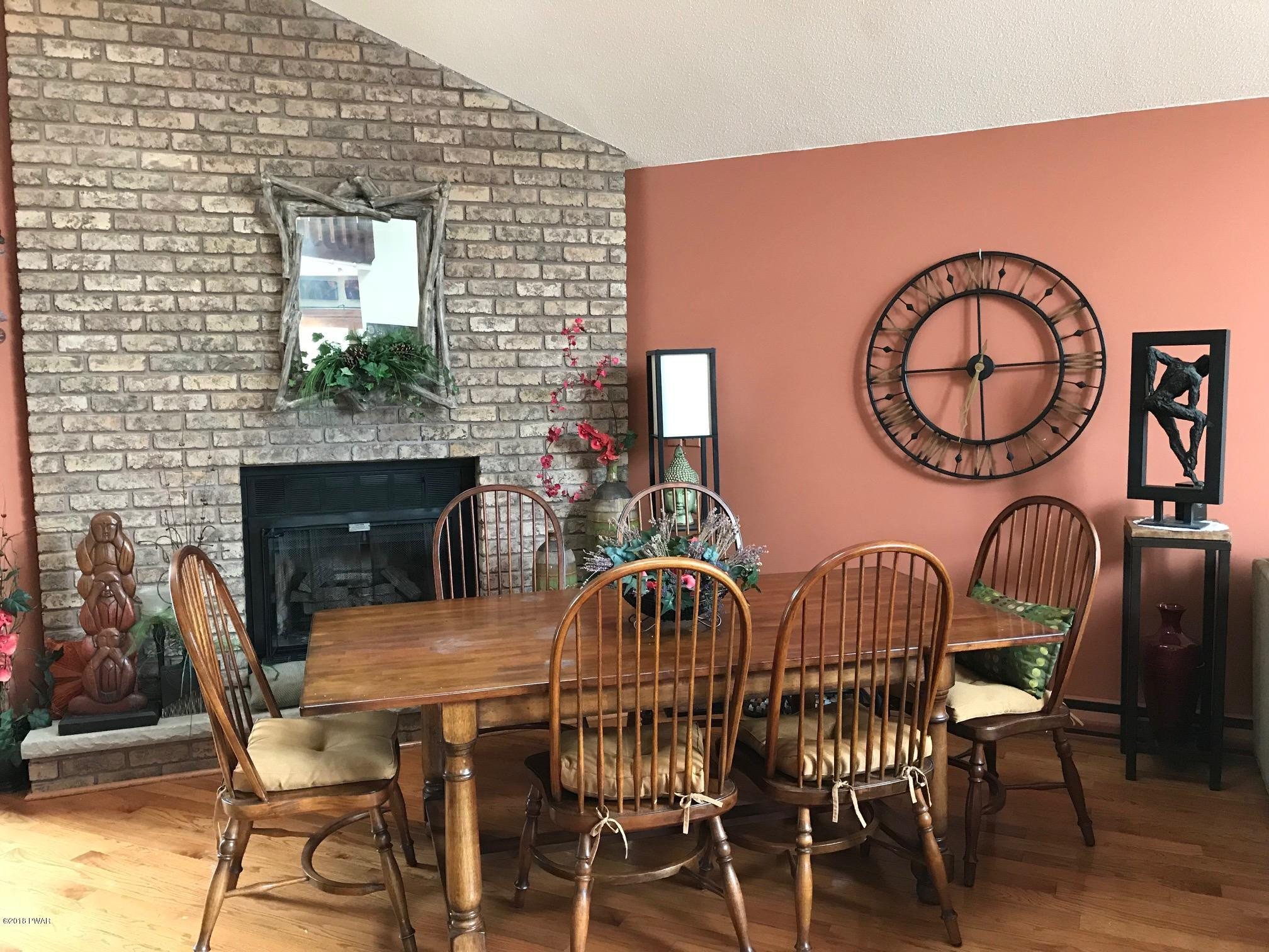 2335 Brookfield Road Lake Ariel, PA 18436 - Photo 5 of 42 a view of a dining room with furniture and wooden floor