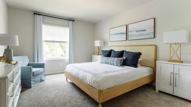 a bedroom with bed and window