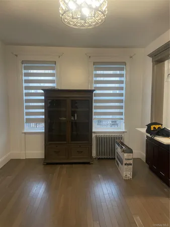 a room with hard wood floor and a window