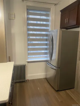 a kitchen with a refrigerator and cabinets