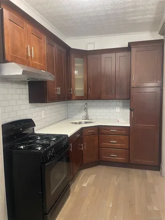 a kitchen with granite countertop stainless steel appliances and cabinets