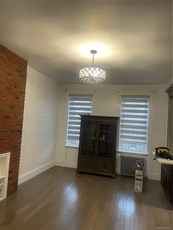 a room with fireplace and wooden floor