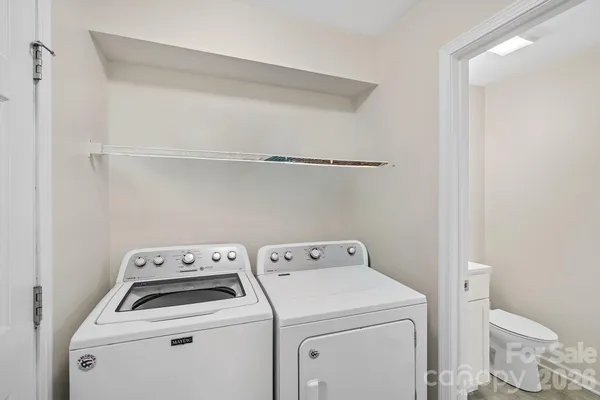 a view of storage and utility room with washer and dryer