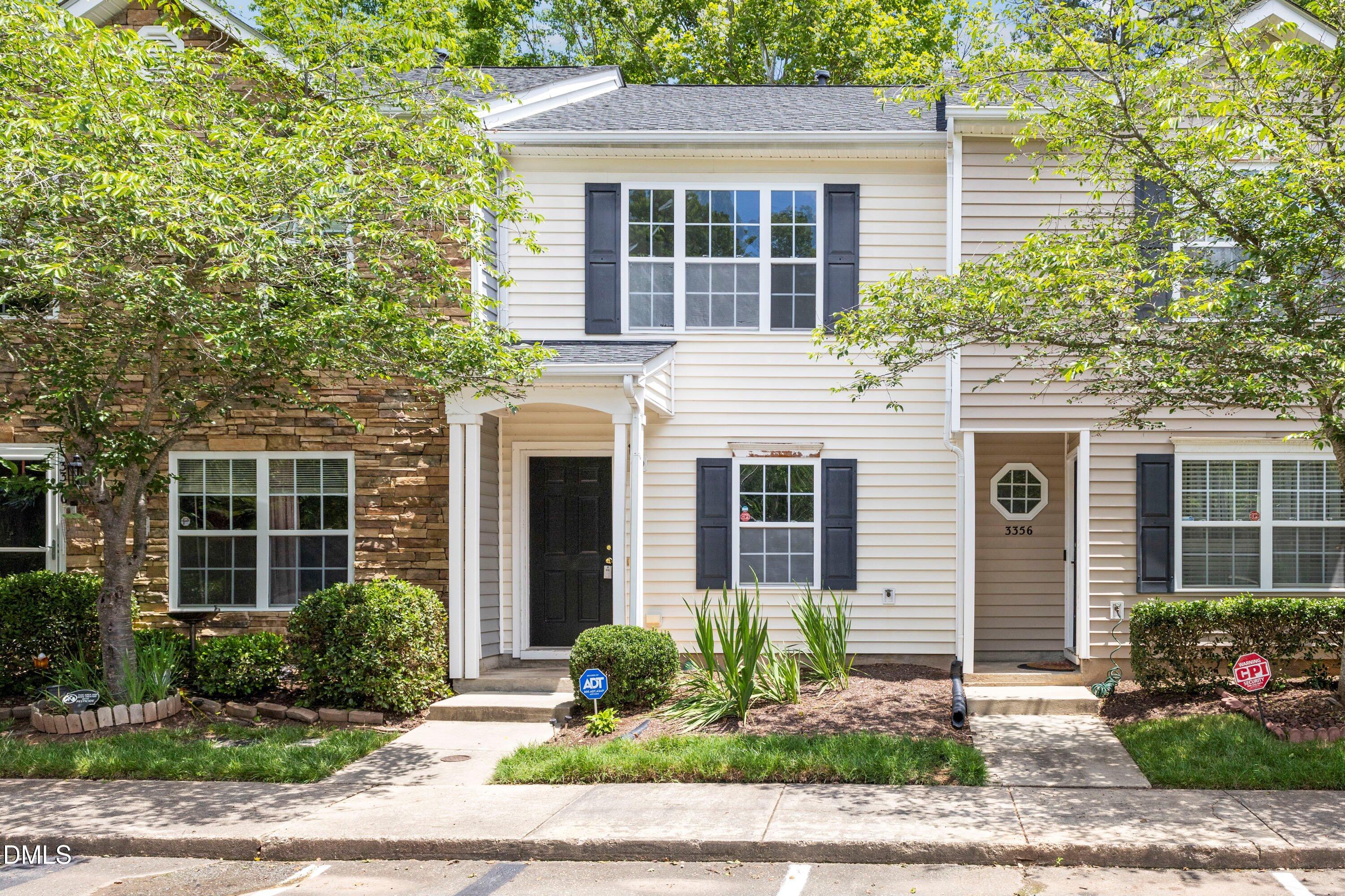 3358 Tarleton West Durham, NC 27713 - Photo 1 of 23 a front view of a house with garden