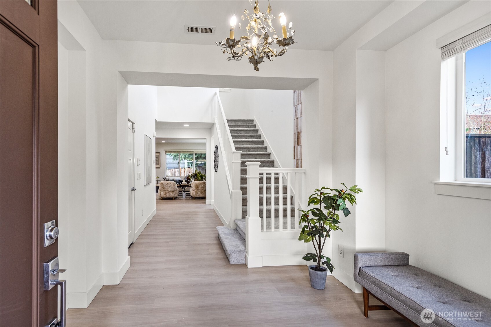 4115 176th Place Southeast Bothell, WA 98012 - Photo 2 of 35 a view of a hallway with furniture and a chandelier