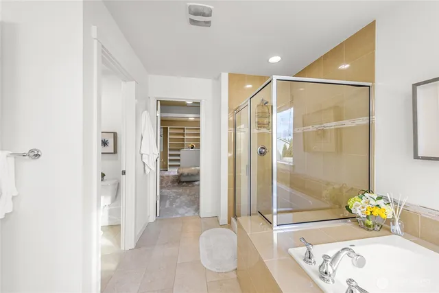 a bathroom with a tub and shower
