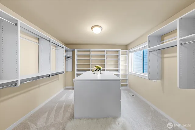 a view of living room with a window and entertaining space