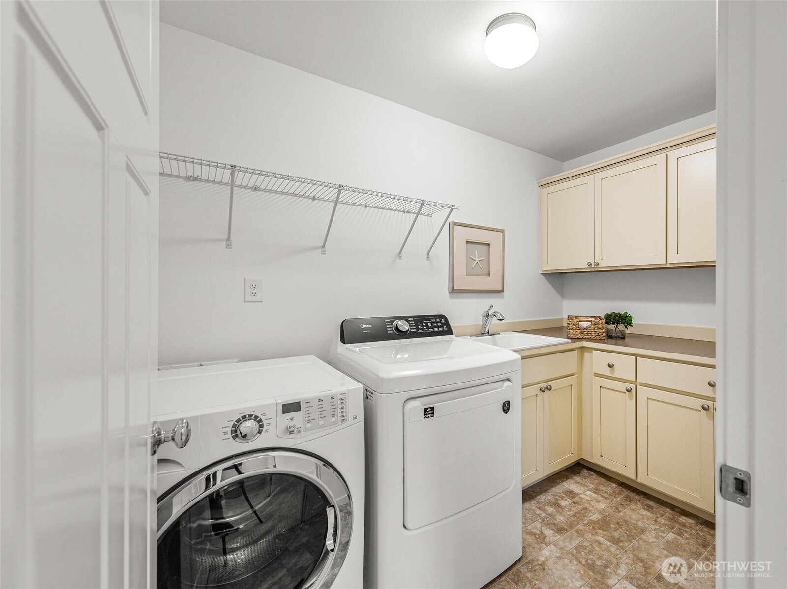 4115 176th Place Southeast Bothell, WA 98012 - Photo 26 of 35 a utility room with sink dryer and washer