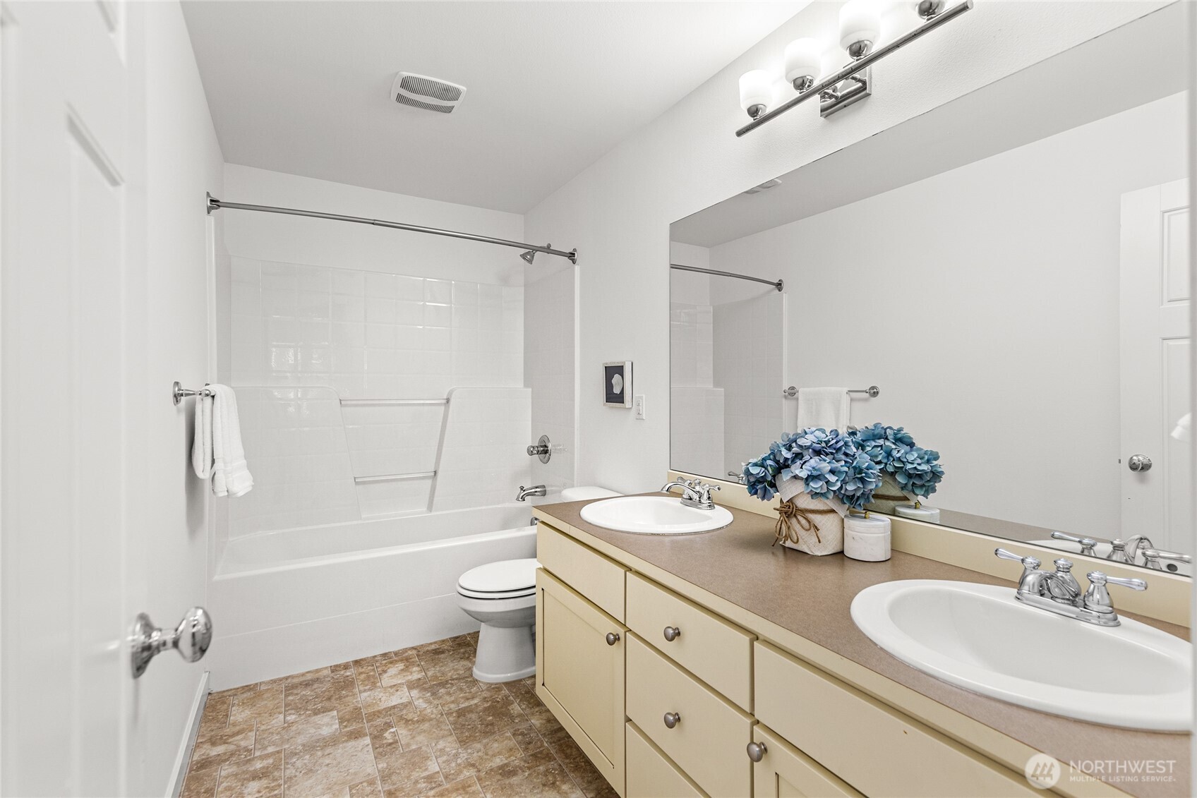 4115 176th Place Southeast Bothell, WA 98012 - Photo 27 of 35 a bathroom with a granite countertop sink toilet mirror and bathtub